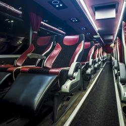 Bus interior showing reclining seats